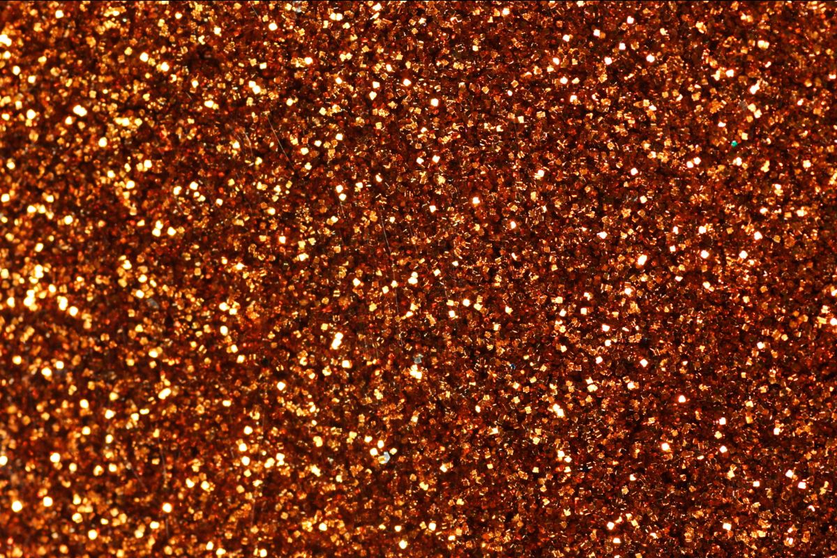 a close-up of golden glitter